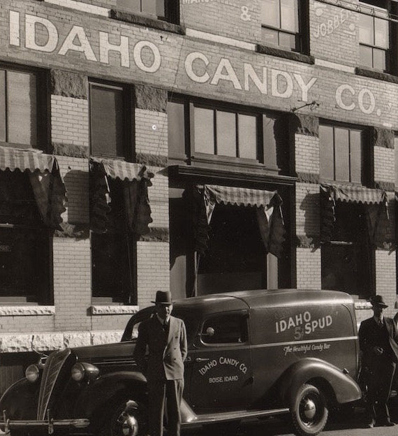 Idaho Spud delivery trucks in a row outside factory